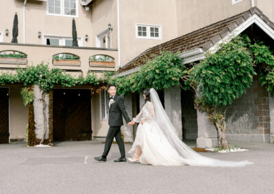 couple walking hand in hand at Chateau Lill