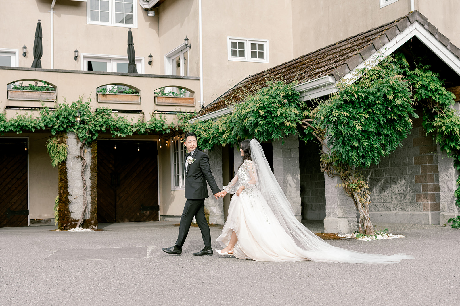 couple walking hand in hand at Chateau Lill